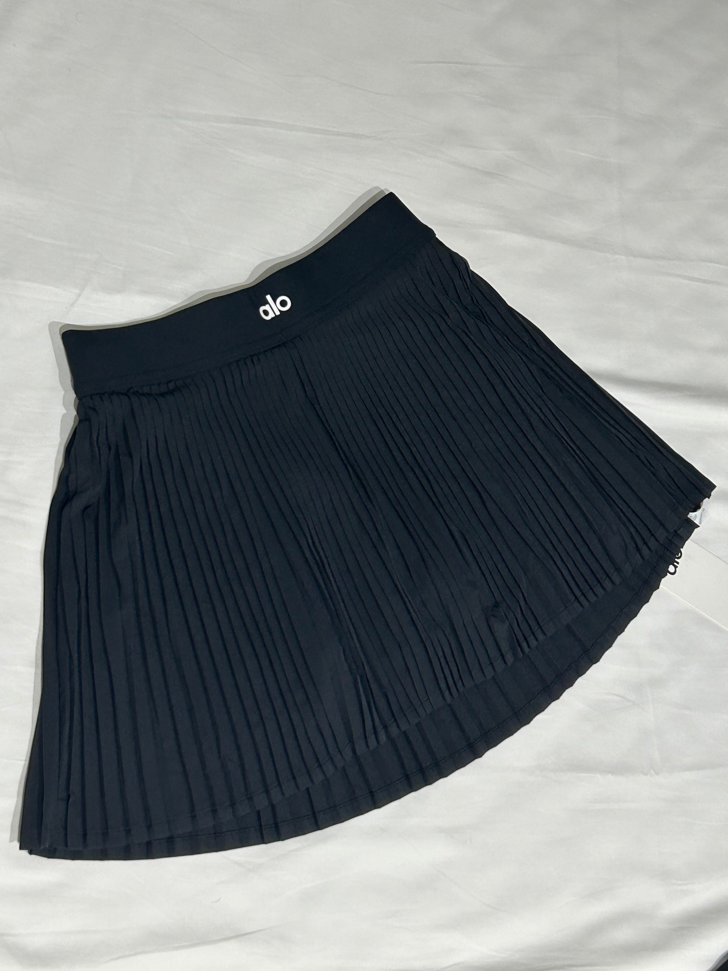 Jupe plissée Alo Yoga noire – jupe femme élégante athleisure